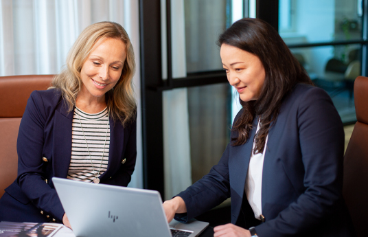 Personal client advisor Sarah discussing wealth management with a client.